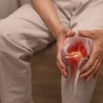 Close-up,Of,An,Elderly,Woman,Holding,Her,Knee,With,Her