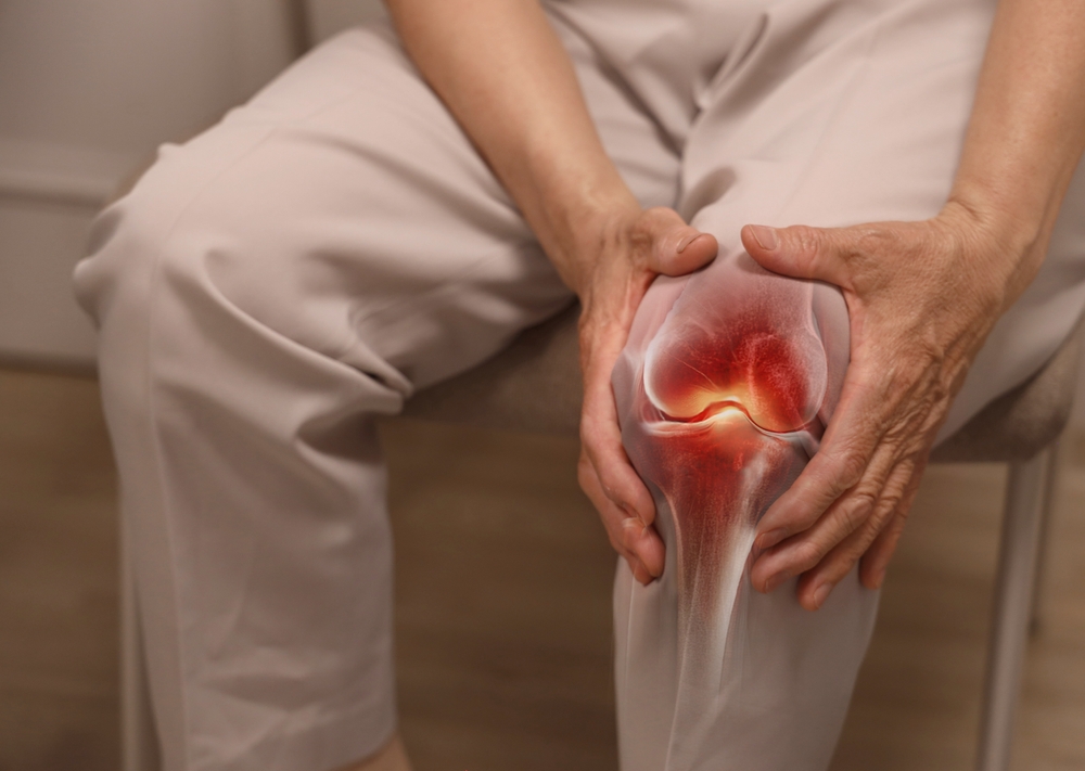 Close-up,Of,An,Elderly,Woman,Holding,Her,Knee,With,Her