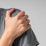 Close-up,Portrait,Of,Young,Woman,Suffering,From,Shoulder,Pain