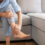Closeup,Young,Woman,Feeling,Pain,In,Her,Foot,At,Home.