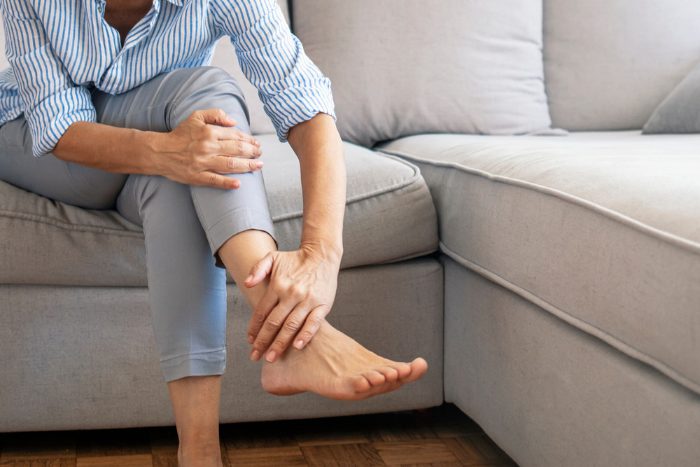 Closeup,Young,Woman,Feeling,Pain,In,Her,Foot,At,Home.
